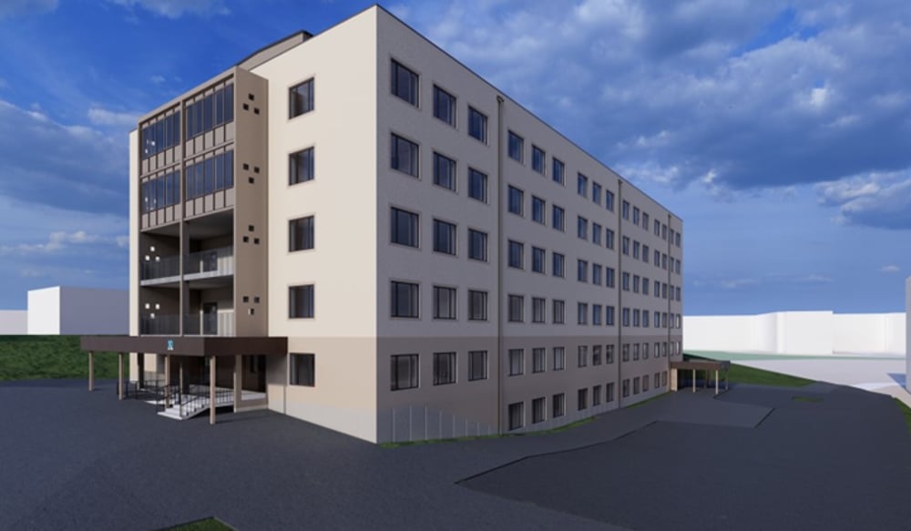 En arkitektrendering av hus 10 på Hudiksvalls sjukhus som det kommer att se ut efter ombyggnation. Byggnaden har fem våningar över mark. Fasaden är ljus och över entrén på kortsidan finns balkonger. 